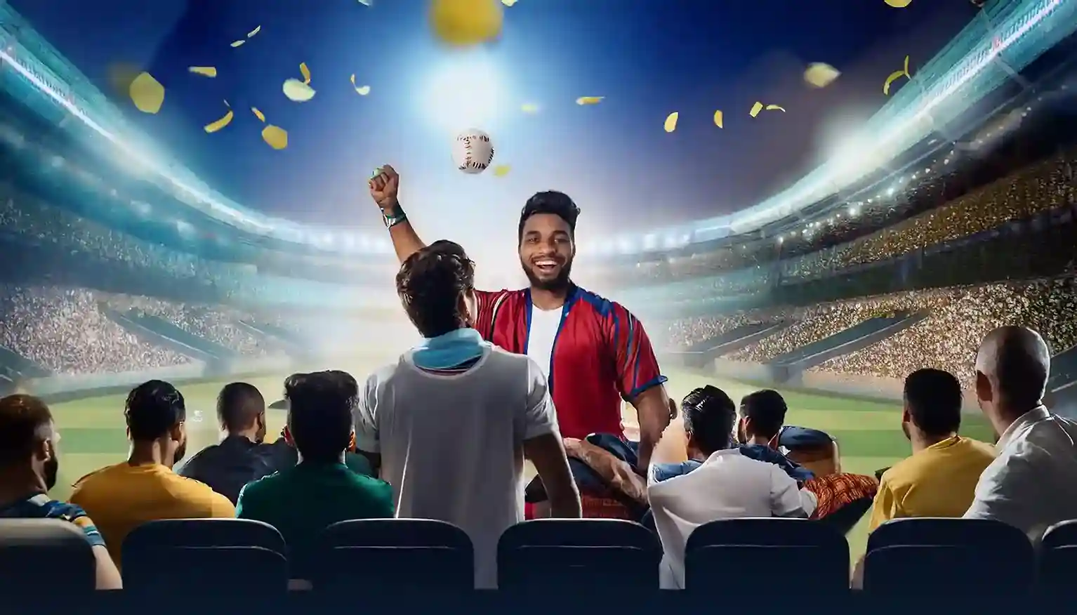 Fan in red jersey catching a ball and celebrating in a floodlit stadium with confetti